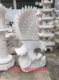 Statue of eagle in the water